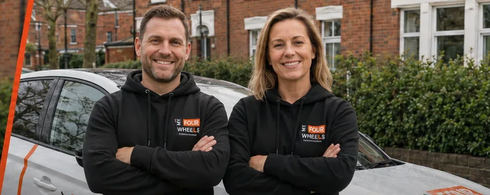 Two My Four Wheels instructors beside a branded dual-control car
